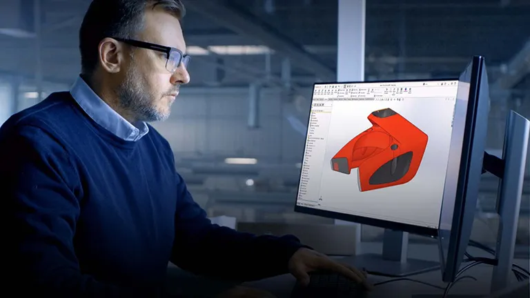 Engineer looking at product design on monitor - 3DEXPERIENCE Works
